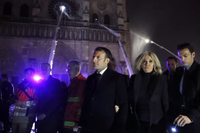 French President Emmanuel Macron alongside Notre-Dame cathedral