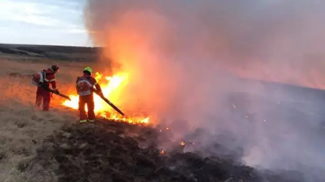 Firefighters fighting the blaze