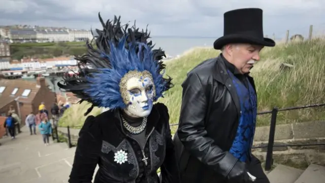 A pair of Goths climbing the stairs to the town's abbey