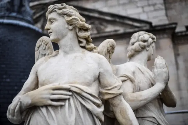 Restored angel statues that were returned to the roof last week