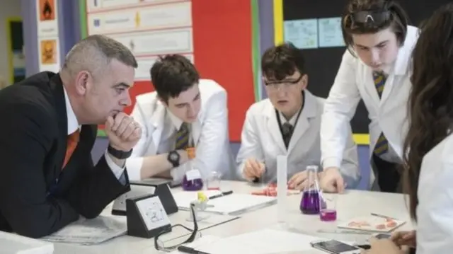 Colin Scott in a classroom