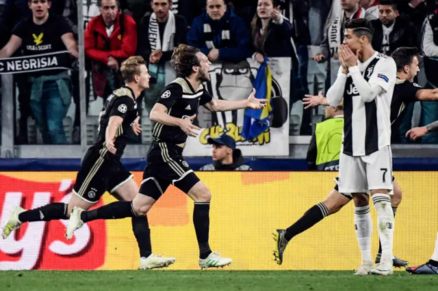 Ajax celebrate as Cristiano Ronaldo looks on