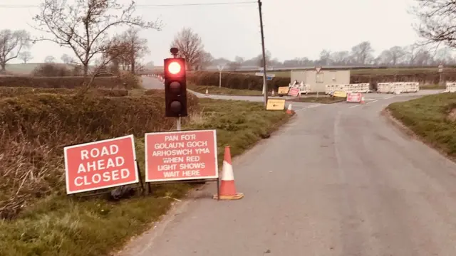 Road sign and traffic lights in Leicestershire