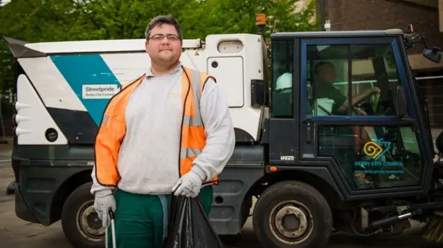 Litter collector in front of waste vehicle