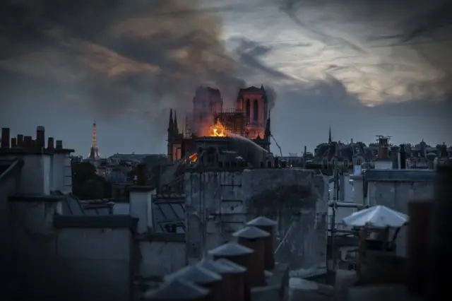 Smoke and flames rise from Notre-Dame Cathedral