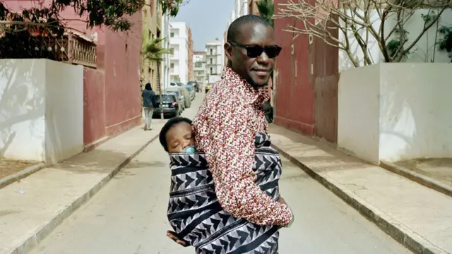 Dad carrying baby on his back