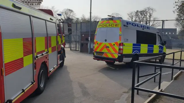 A fire engine and a police van