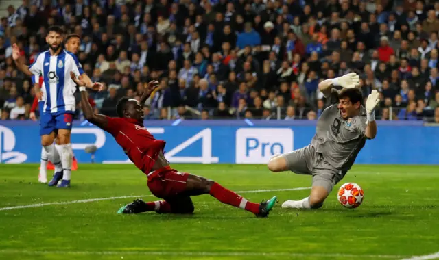 Sadio Mane slides in the opener for Liverpool