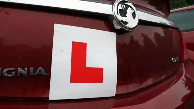 An L plate on a car