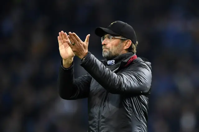 Jurgen Klopp applauds the Liverpool supporters