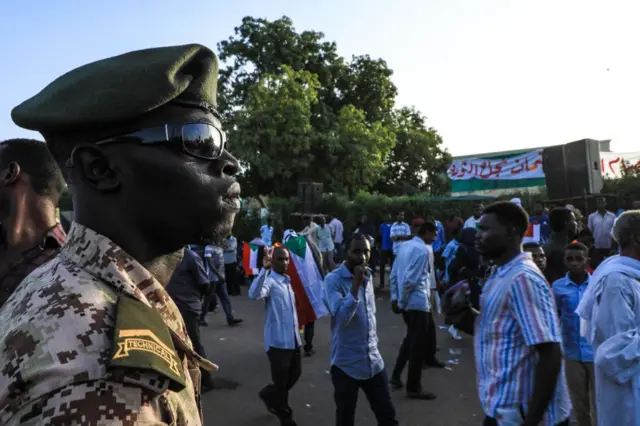 Sudanese military personnel take measures during a demonstration demanding a civilian transition government, in front of military headquarters in Khartoum, Sudan on April 16, 2019.