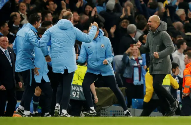 Pep Guardiola celebrates before the offside decision is given