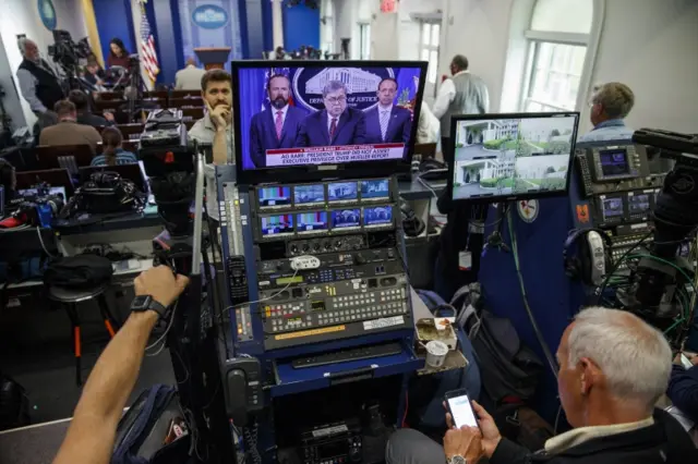 White House reporters watched the news conference from the briefing room