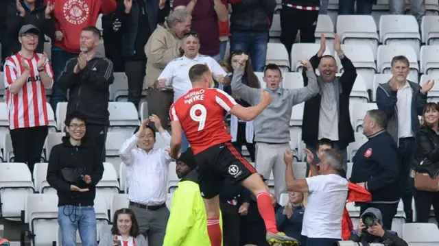 Charlie Wyke celebrates