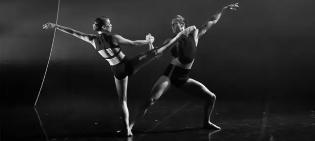 Black and white image of two female ballet dancers