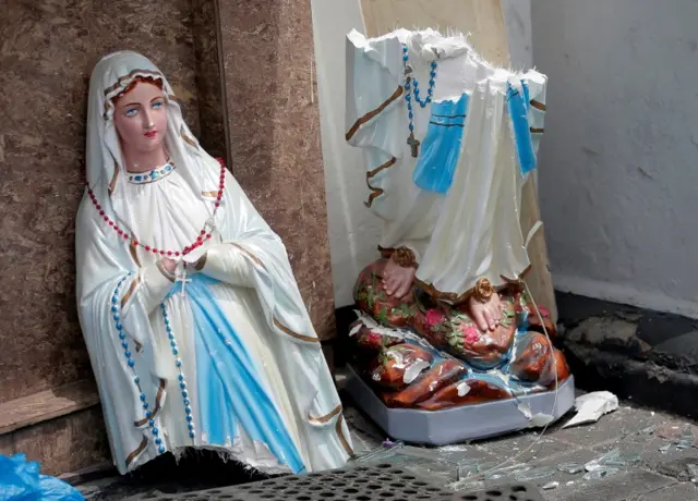 A broken statue of the Virgin Mary