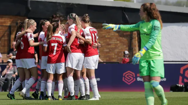 Arsenal celebrate the game's opening goal