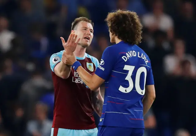 Chelsea's David Luiz clashes with Burnley striker Ashley Barnes