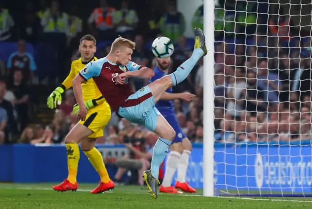 Ben Mee clears off the line for Burnley