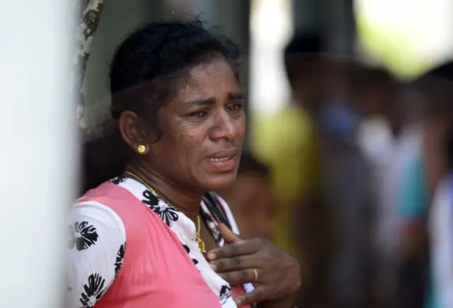 A Sri Lankan relative of a bomb blast victim weeps at a morgue in Colombo