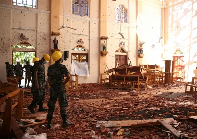 Investigators inside St Sebastian church, Negombo