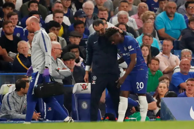 Manager Maurizio Sarri puts his arm round injured Callum Hudson-Odoi as he leaves the pitch