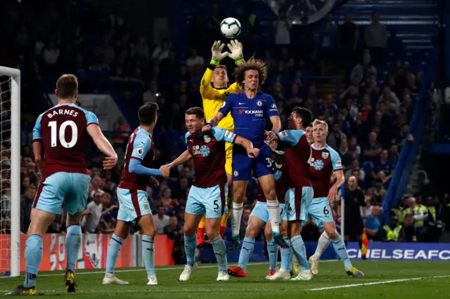 Tom Heaton claims the ball above Chelsea's David Luiz