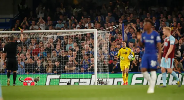 Tom Heaton is shown a yellow card