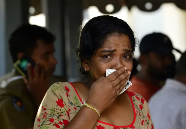 A Sri Lankan relative of a bomb blast victim weeps at a morgue in Colombo