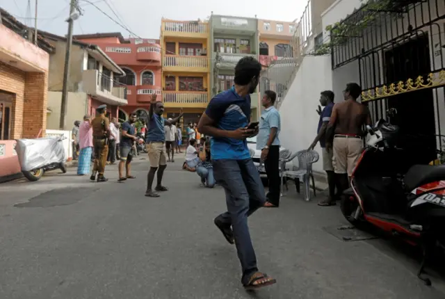 People who live near the church that was attacked yesterday, leave their houses as the military try to defuse a suspected van before it exploded in Colombo