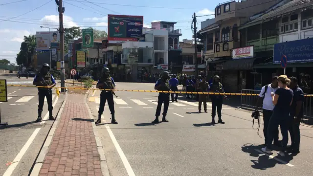 Armed police at a security cordon outside St Anthony's church, Colombo