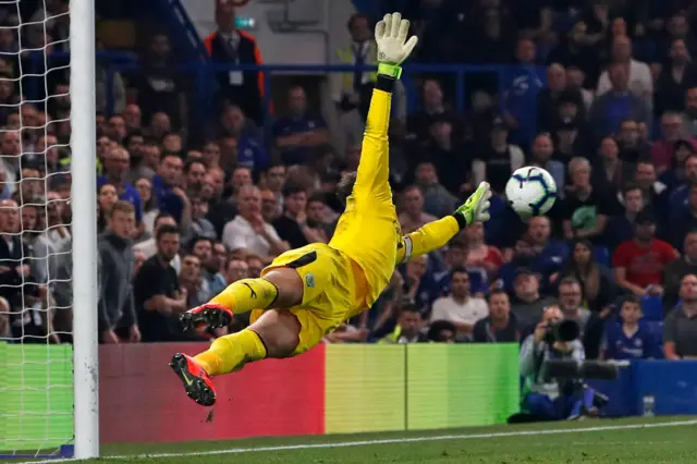 Tom Heaton dives to cover an Emerson shot