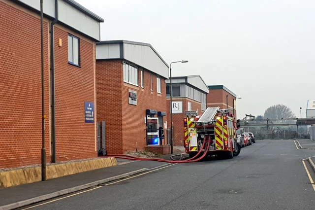 Fire engine at scene of factory fire