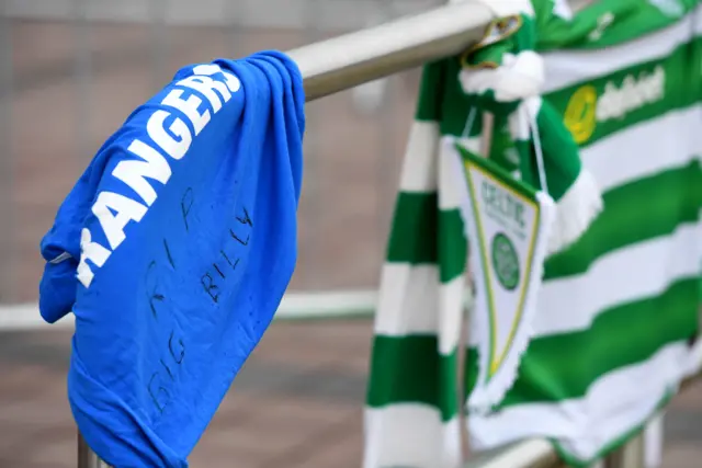 A Rangers top adorns the Billy McNeill tribute outside Celtic Park