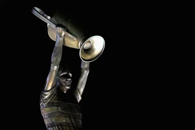 A statue of Billy McNeill with the European Cup stands outside Celtic Park