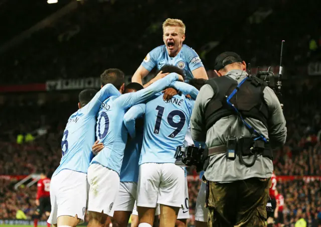 Man City players celebrate a comfortable win