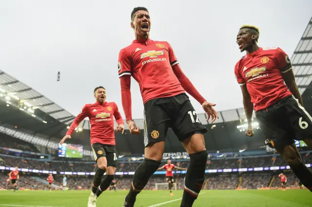 Chris Smalling celebrates scoring the decisive goal of a 3-1 win for Manchester United at the Etihad last season