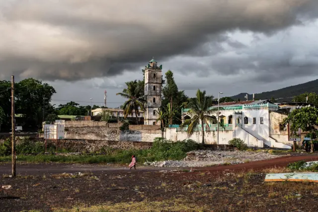 A Comoran woman walks by the Harbour on March 25, 2019 in Moroni, Comoros.