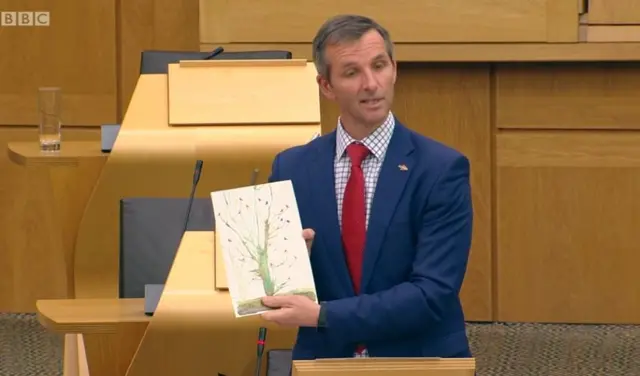 Lib Dem MSP Liam McArthur with a painting