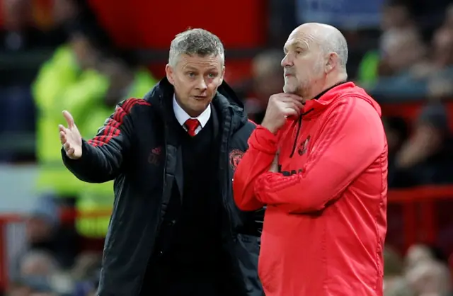 Ole Gunnar Solskjaer talks with Mike Phelan