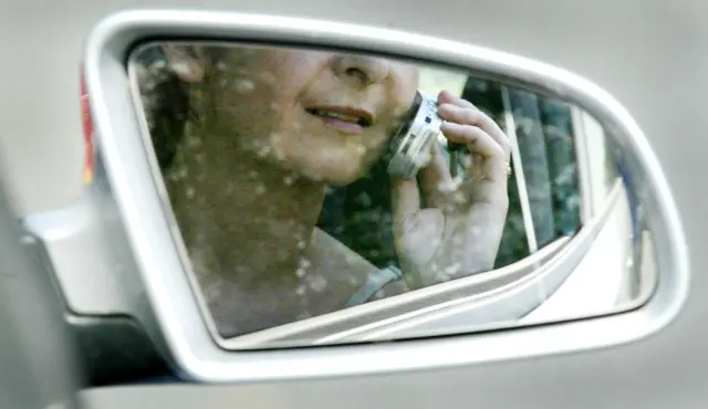 Woman on phone in car