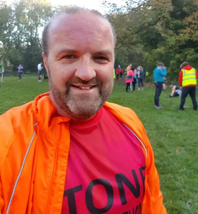 Selfie of Adam before a training run in a park