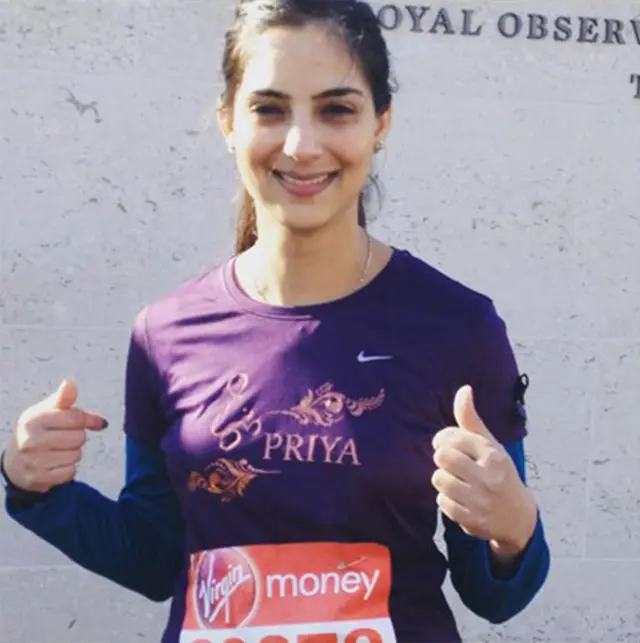 Priya poses in her running gear.