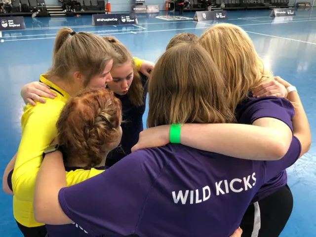 Wild kicks team huddle