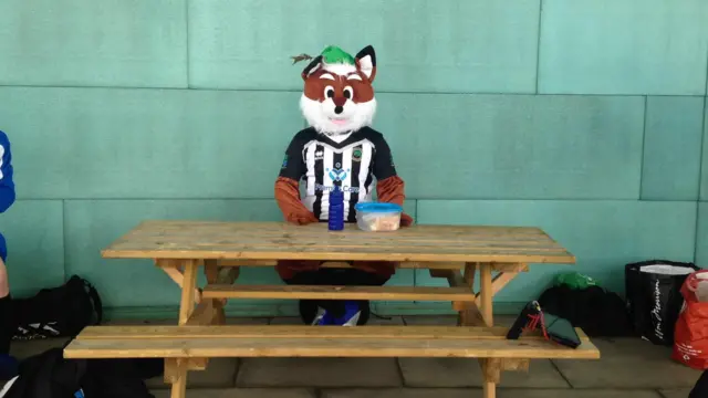 Fox mascot eats lunch at the FA People's