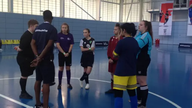 Futsal girls get pre-match briefing