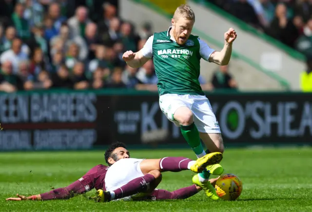 Hearts' Sean Clare slide tackles Daryl Horgan