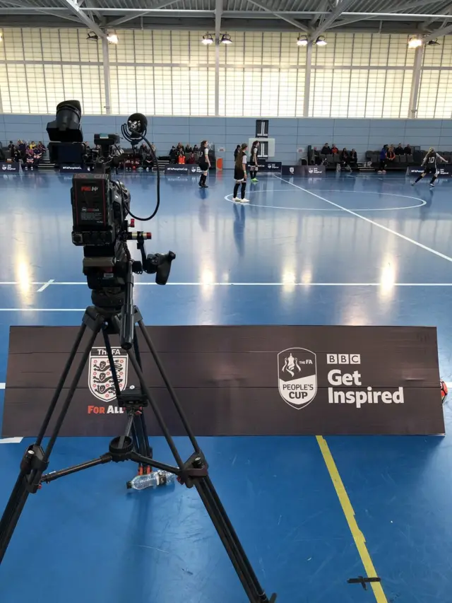 Filming the action in the futsal hall