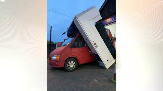 Van tears away top of car wash