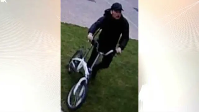 A man with a bicycle who police want to identify